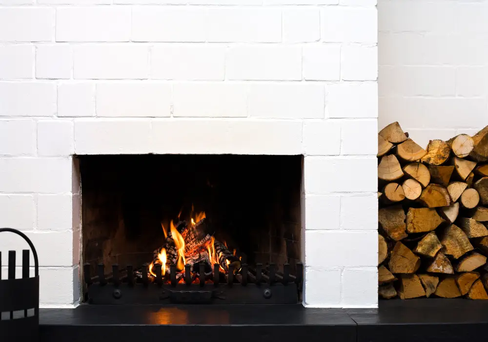 Surfaces Back to Life with Precision Cleaning open fire-place in a living-room, stacked wood at side